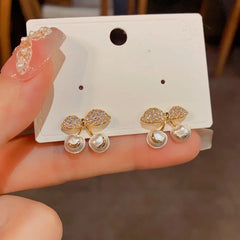 Angled view of the 14K Gold-Plated Elegant Zircon Pearl Cherry Earrings