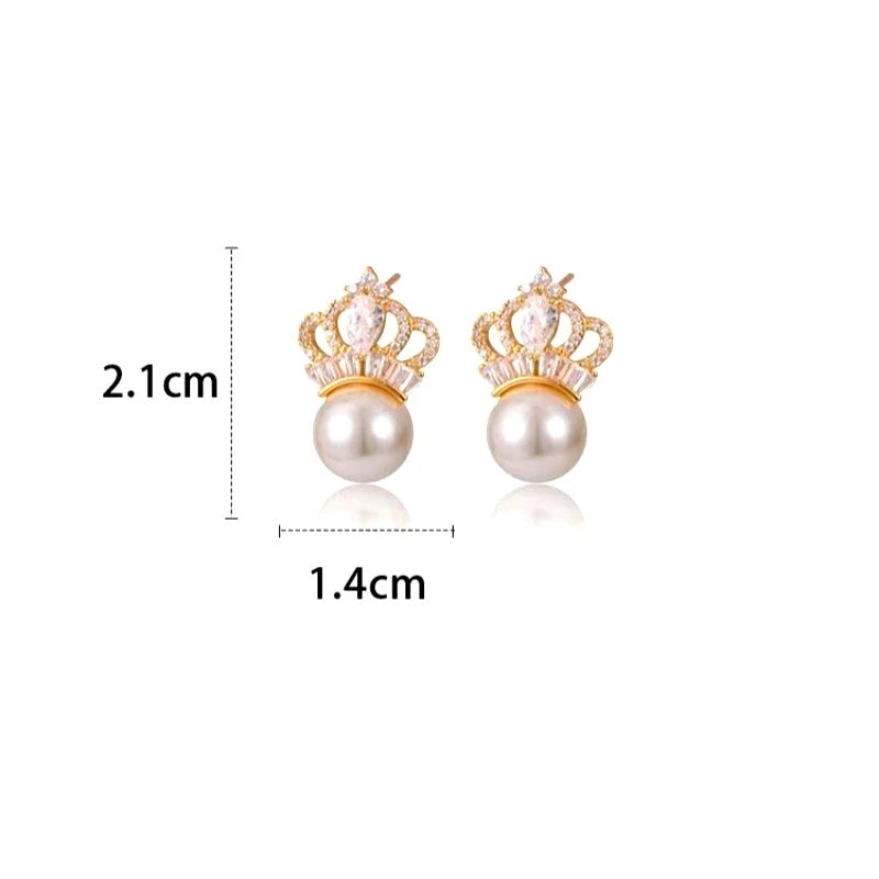 Close-up detail of the sparkling zircons and plating on the gold pearl earrings