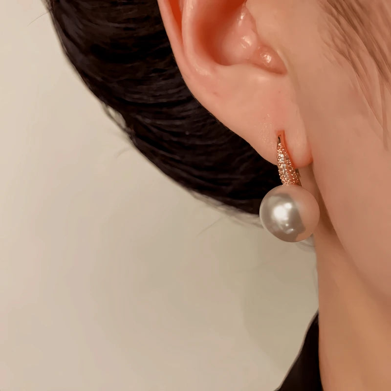 Angled view of the 14K Gold-Plated Elegant Zircon Pearl Ear Hooks
