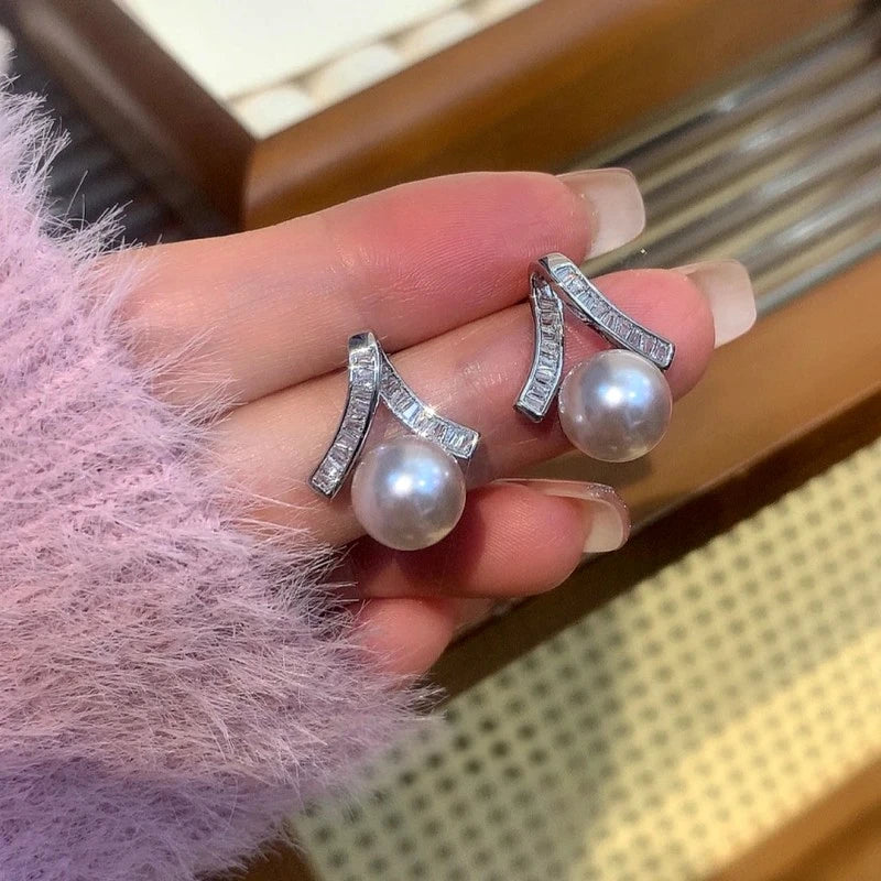 Angled view of the 14K Gold-Plated Elegant Zircon Pearl Earrings