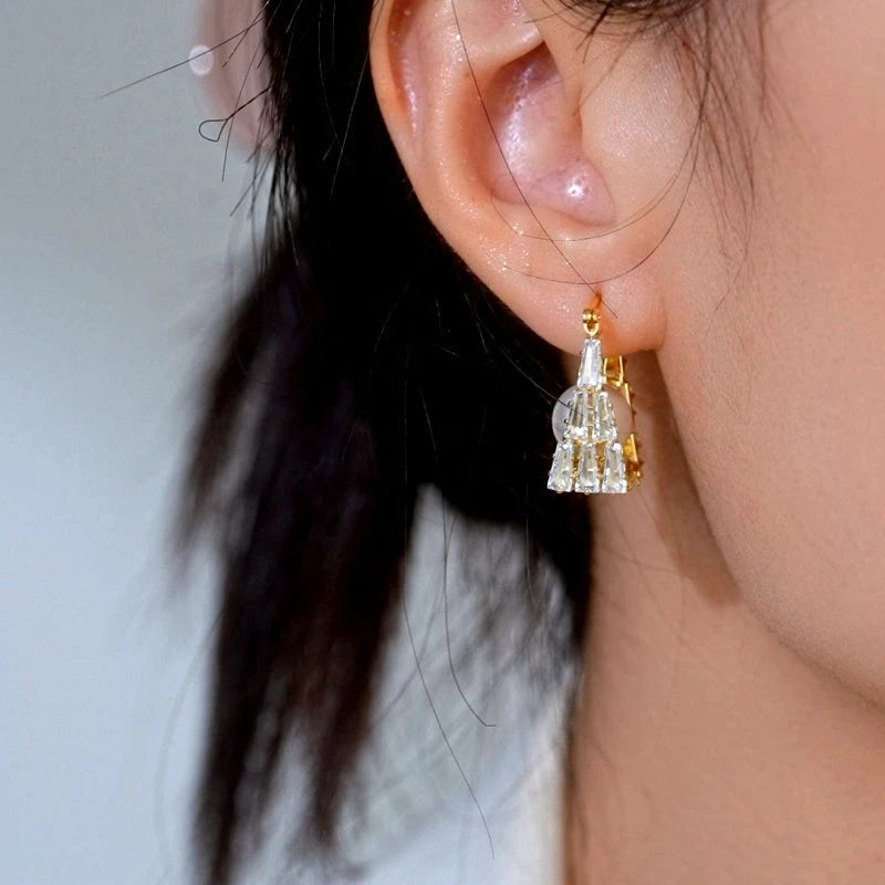 Model showcasing the dangle and style of the 14K Gold-Plated Elegant Zircon Pearl Earrings