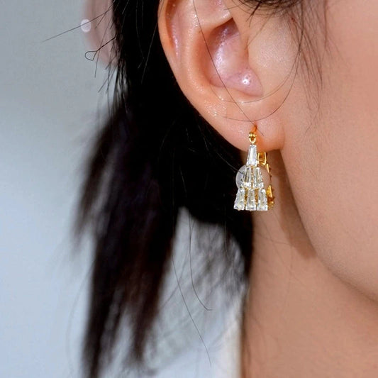 Model showcasing the dangle and style of the 14K Gold-Plated Elegant Zircon Pearl Earrings