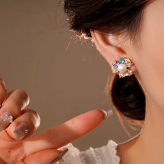 Angled view of the 14K Gold-Plated Elegant Zircon Pearl Flower Stud Earrings