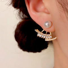 Model showcasing the dangle and style of the 14K Gold-Plated Elegant Zircon Pearl Jacket Earrings