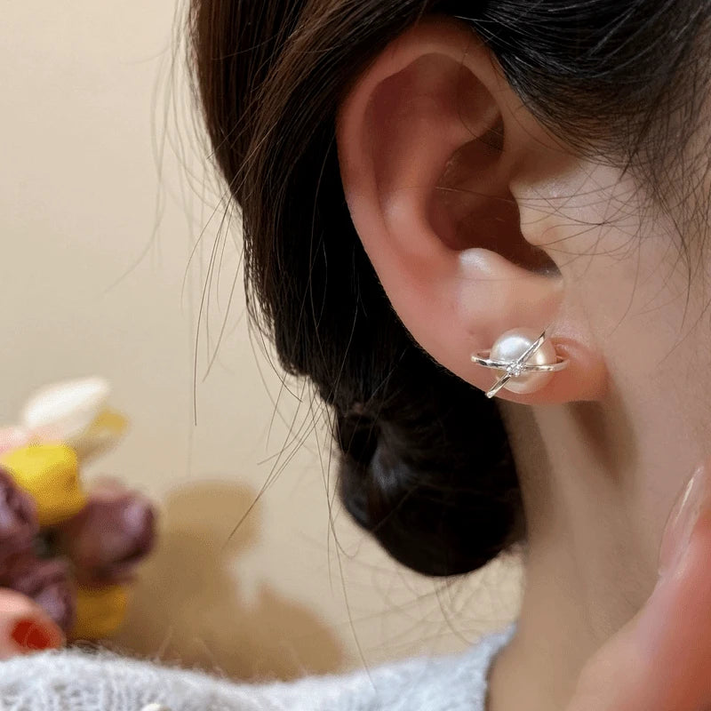 Model showcasing the dangle and style of the 14K Gold-Plated Elegant Zircon Pearl Stud Earrings