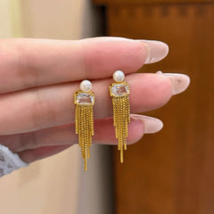 Angled view of the 14K Gold-Plated Elegant Zircon Pearl Tassel Earrings
