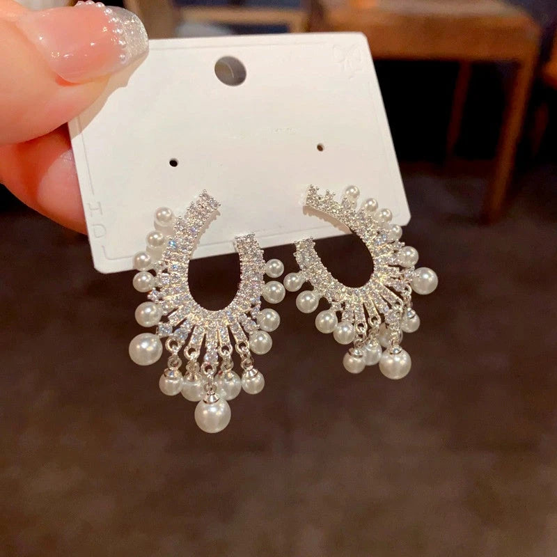 Angled view of the 14K Gold-Plated Elegant Zircon Pearl Tassel Earrings