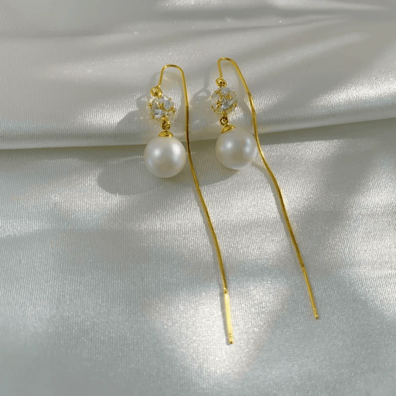 Angled view of the 14K Gold-Plated Elegant Zircon Pearrl Threader Earrings