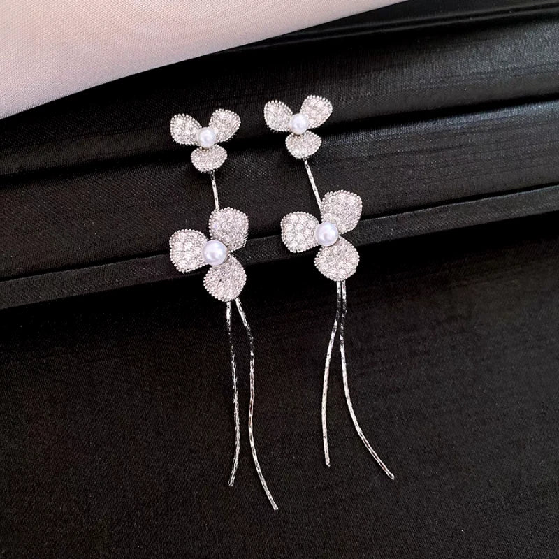 Angled view of the 14K Gold-Plated Elegant Zircon Petal Flower Tassel Earrings