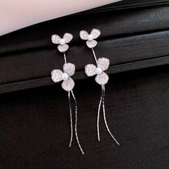 Angled view of the 14K Gold-Plated Elegant Zircon Petal Flower Tassel Earrings