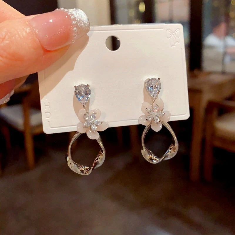 Angled view of the 14K Gold-Plated Elegant Zircon Petal Geometric Tassel Earrings