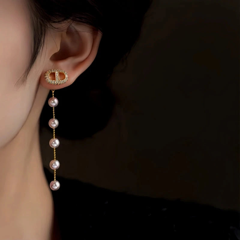 Close-up detail of the sparkling zircons and plating on the Pig Nose Pearl Earrings
