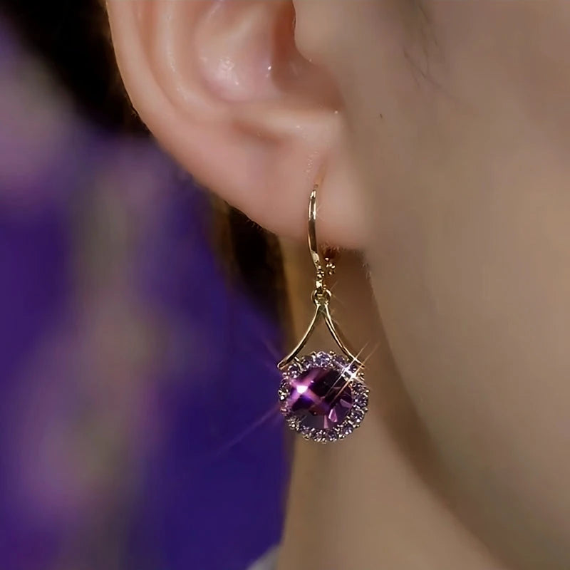 Close-up detail of the sparkling zircons and plating on the Purple Crystal Earrings