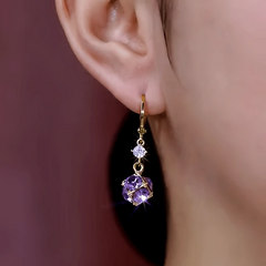 Model showcasing the dangle and style of the 14K Gold-Plated Elegant Zircon Purple Diamond Ball Earrings