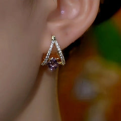 Close-up detail of the sparkling zircons and plating on the Purple Diamond Earrings