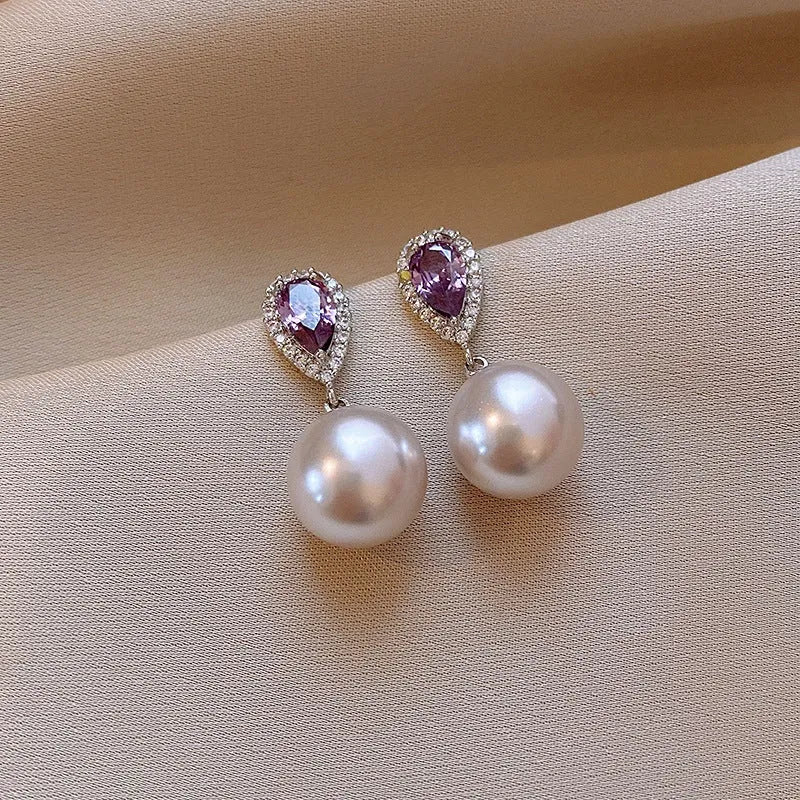 Angled view of the 14K Gold-Plated Elegant Zircon Purple Diamond Pearl Earrings