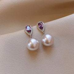 Angled view of the 14K Gold-Plated Elegant Zircon Purple Diamond Pearl Earrings