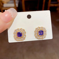 Close-up detail of the sparkling zircons and plating on the Purple Stud Earrings