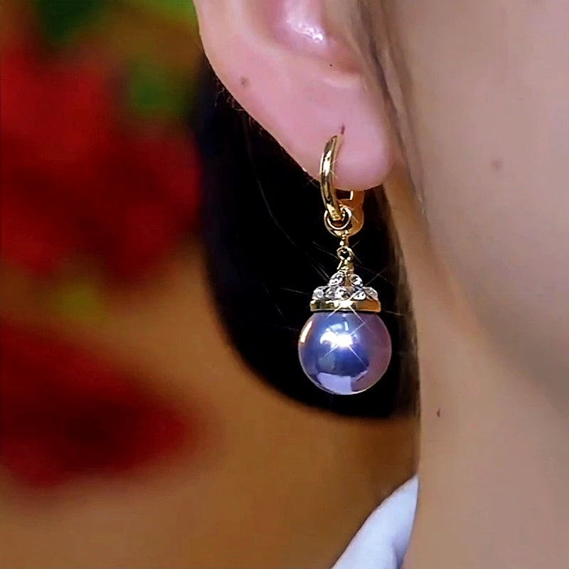 Close-up detail of the sparkling zircons and plating on the Pearl Hoop Earrings