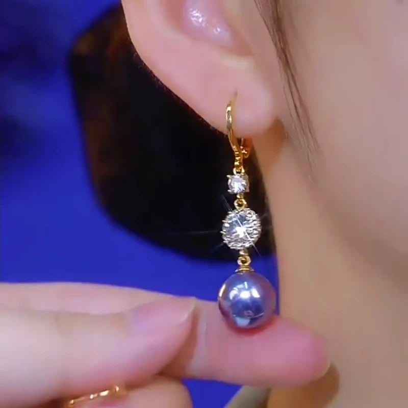 Close-up detail of the sparkling zircons and plating on the Purple Pearl Earrings