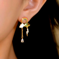 Model showcasing the dangle and style of the 14K Gold-Plated Elegant Zircon Rainbow Cloud Earrings