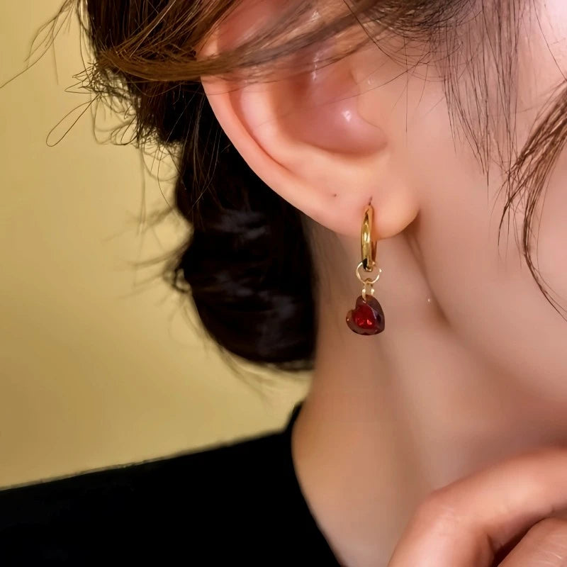 Close-up detail of the sparkling zircons and plating on the Red Heart Earrings