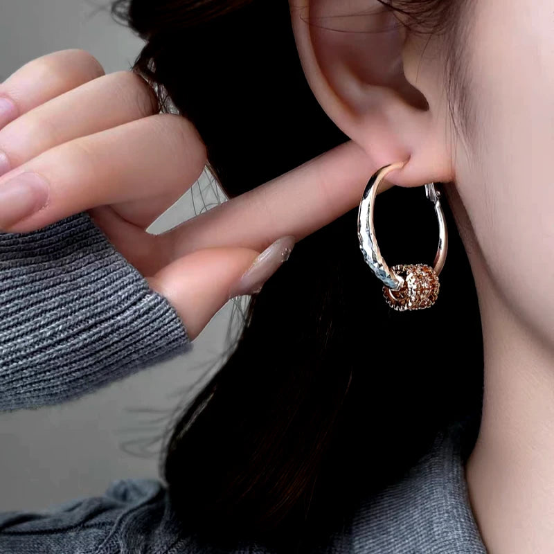 Close-up detail of the sparkling zircons and plating on the Ring Hoop Earrings