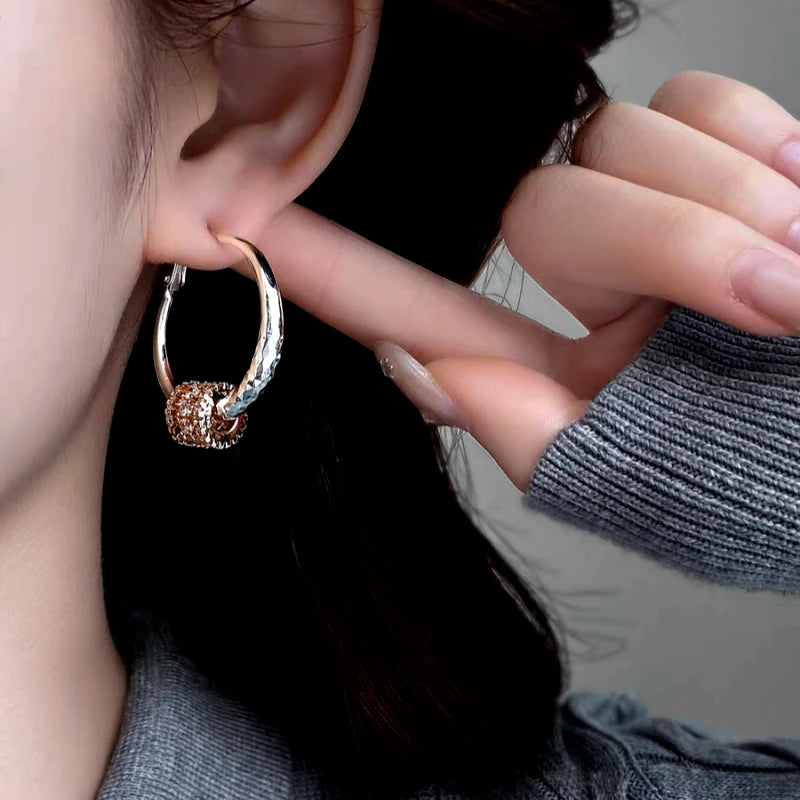 Angled view of the 14K Gold-Plated Elegant Zircon Ring Hoop Earrings