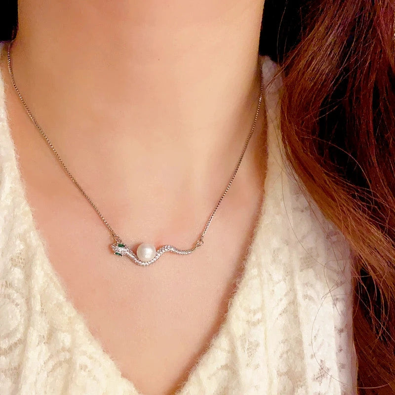 14K Gold-Plated Elegant Zircon Ripple Pearl Snake Necklace worn to showcase its length and pendant detail