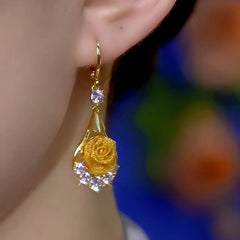 Close-up detail of the sparkling zircons and plating on the Zircon Rose Earrings