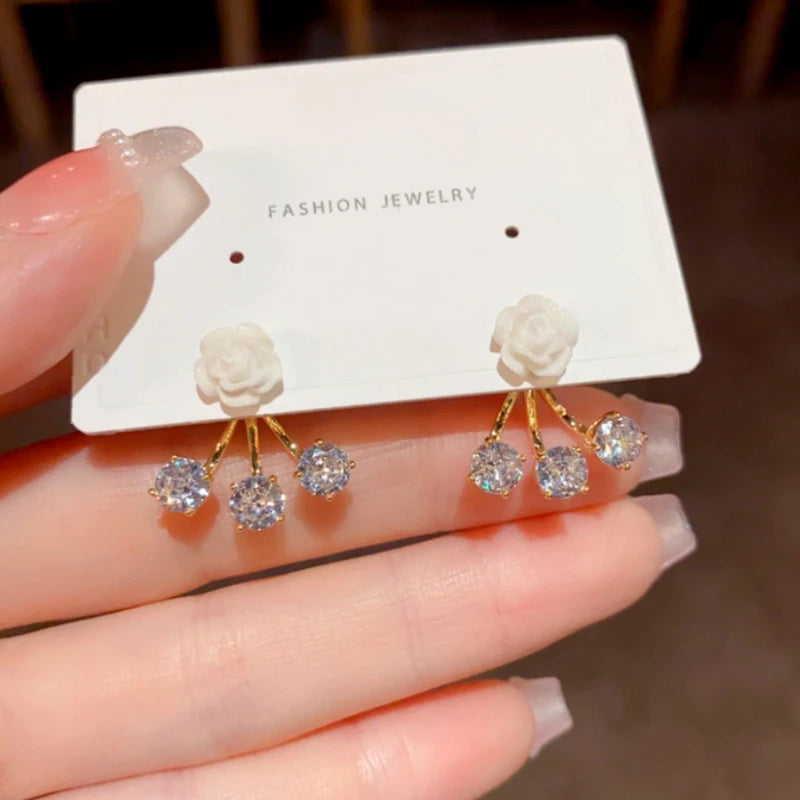 Close-up detail of the sparkling zircons and plating on the Rose Jacket Earrings