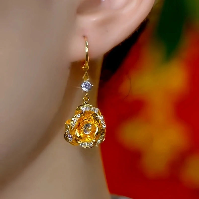 Model showcasing the dangle and style of the 14K Gold-Plated Elegant Zircon Rose Lady Earrings