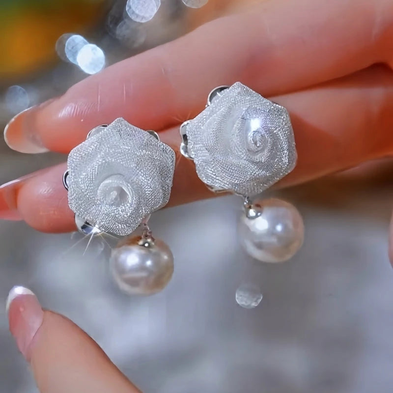 Close-up detail of the sparkling zircons and plating on the Rose Pearl Earrings