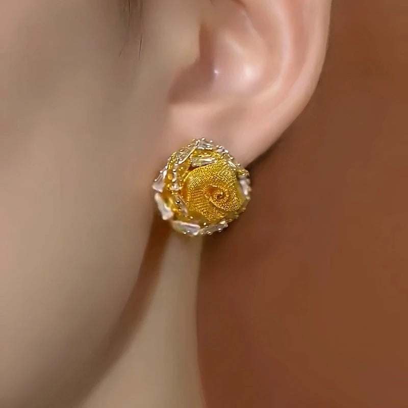 Model showcasing the dangle and style of the 14K Gold-Plated Elegant Zircon Rose Stud Earrings