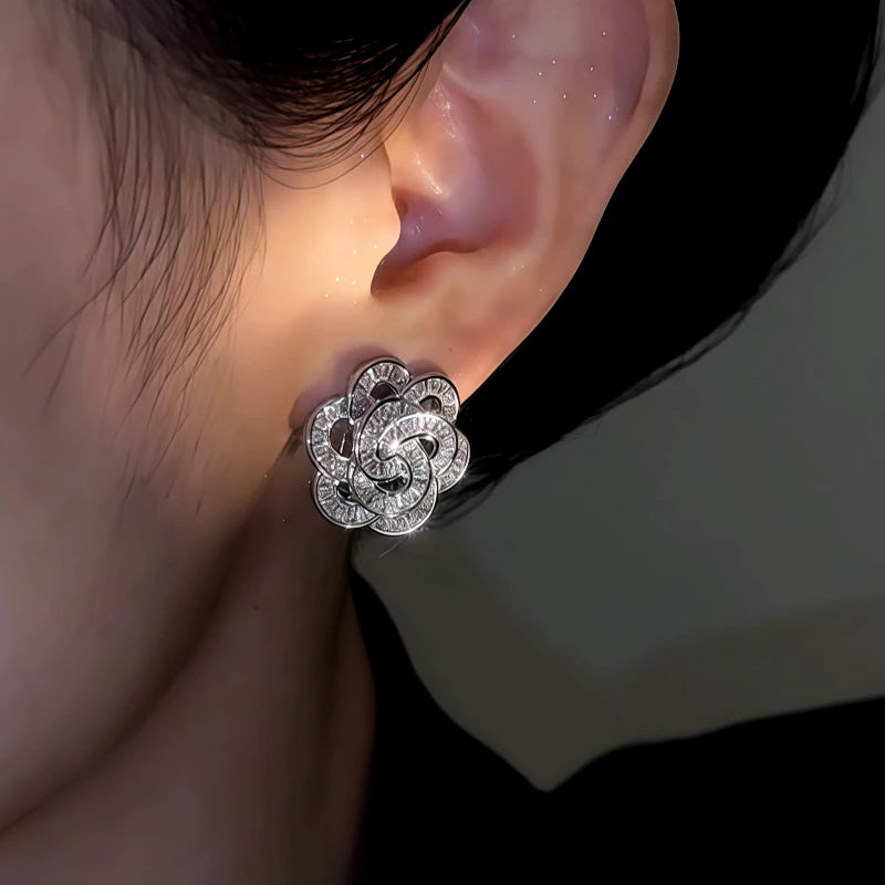 Close-up detail of the sparkling zircons and plating on the Rose Stud Earrings