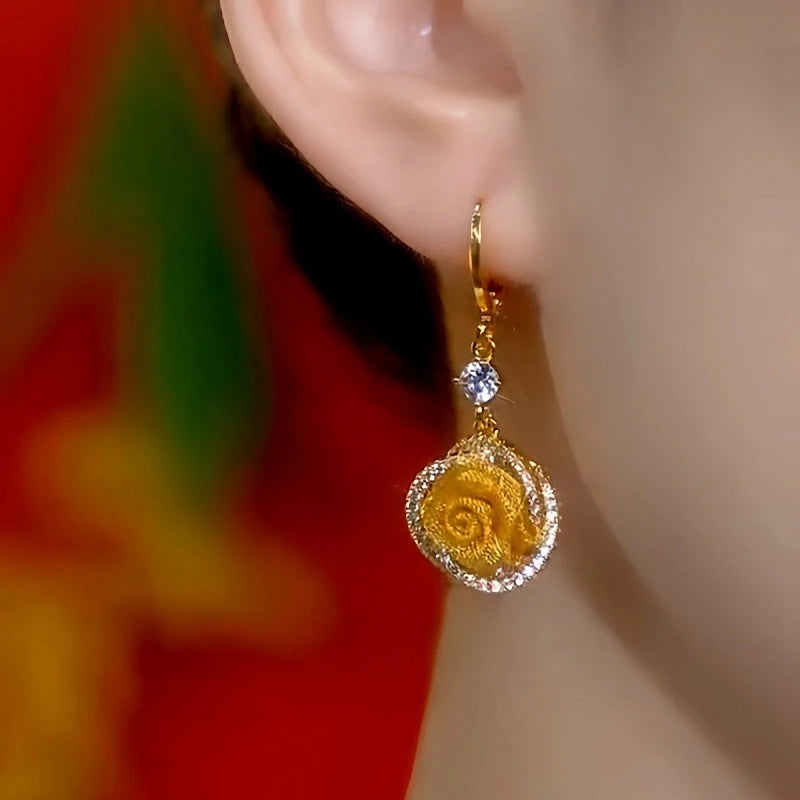 Close-up detail of the sparkling zircons and plating on the Rose Tassel Earrings