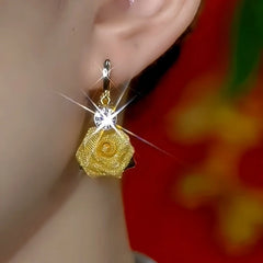 Close-up detail of the sparkling zircons and plating on the Rose Tassel Earrings