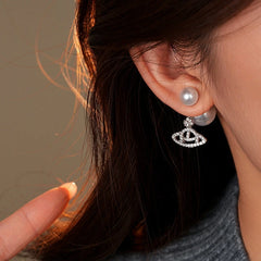 Model showcasing the dangle and style of the 14K Gold-Plated Elegant Zircon Saturn Pearls Earrings