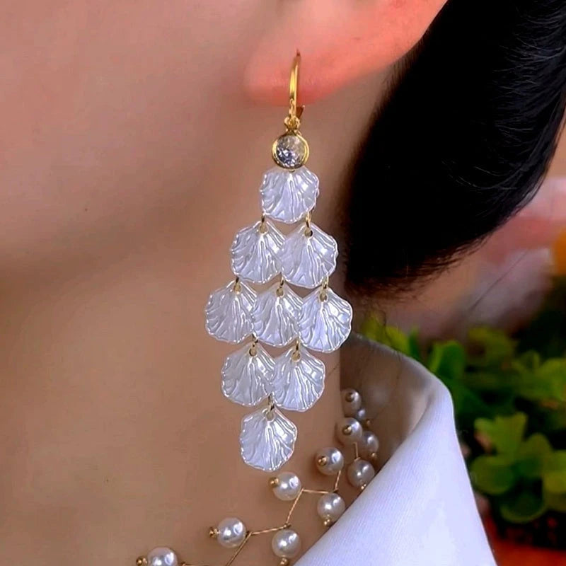 Close-up detail of the sparkling zircons and plating on the Zircon Shell Earrings