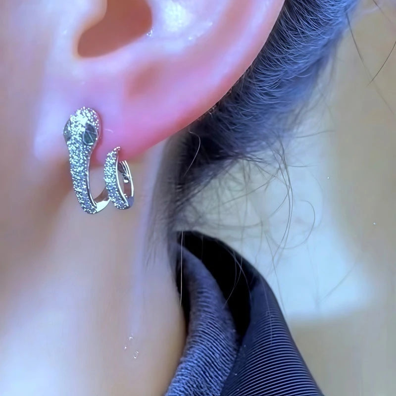 Close-up detail of the sparkling zircons and plating on the Snake Design Earrings