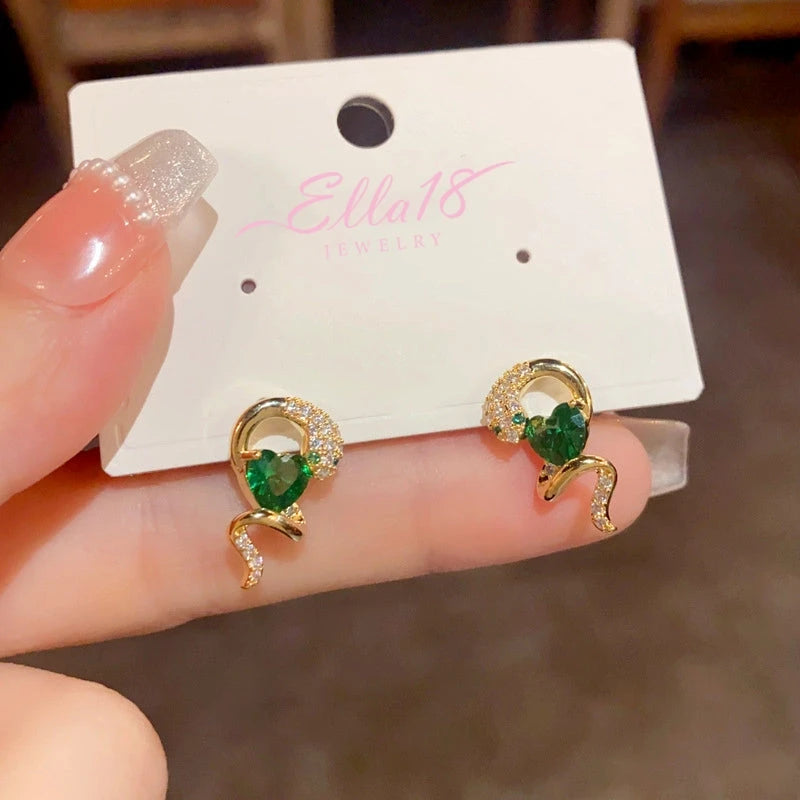 Close-up detail of the sparkling zircons and plating on the Snake Heart Earrings