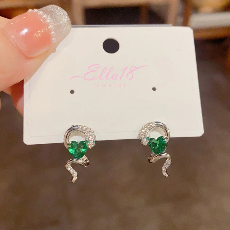 Angled view of the 14K Gold-Plated Elegant Zircon Snake-Shaped Emerald Heart Earrings