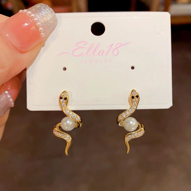 Close-up detail of the sparkling zircons and plating on the Snake Pearl Earrings