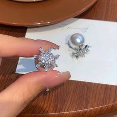 Angled view of the 14K Gold-Plated Elegant Zircon Snowflake Pearl Earrings