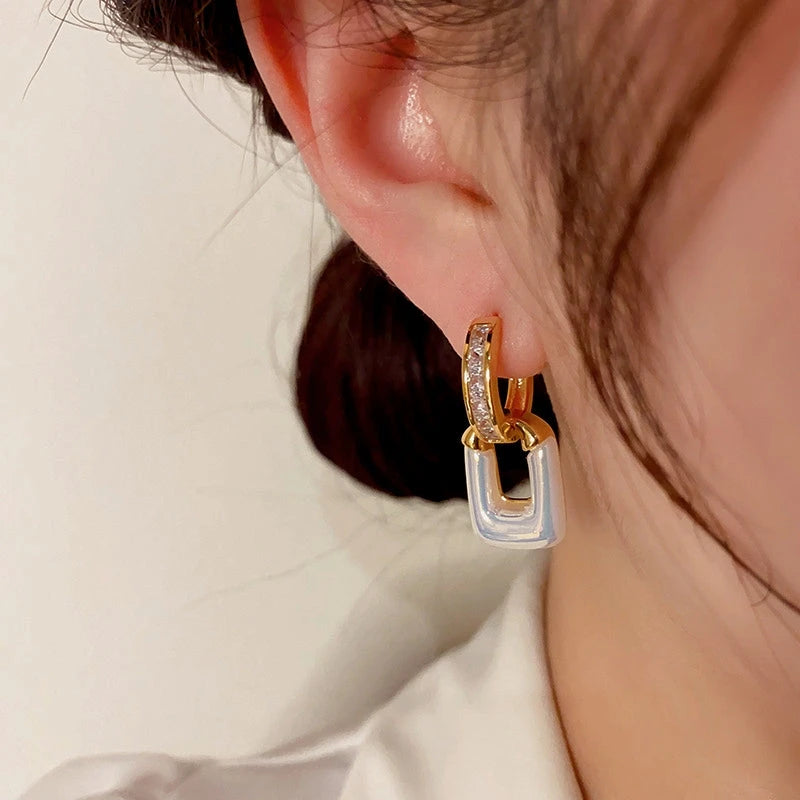 Close-up detail of the sparkling zircons and plating on the Square Hoop Earrings