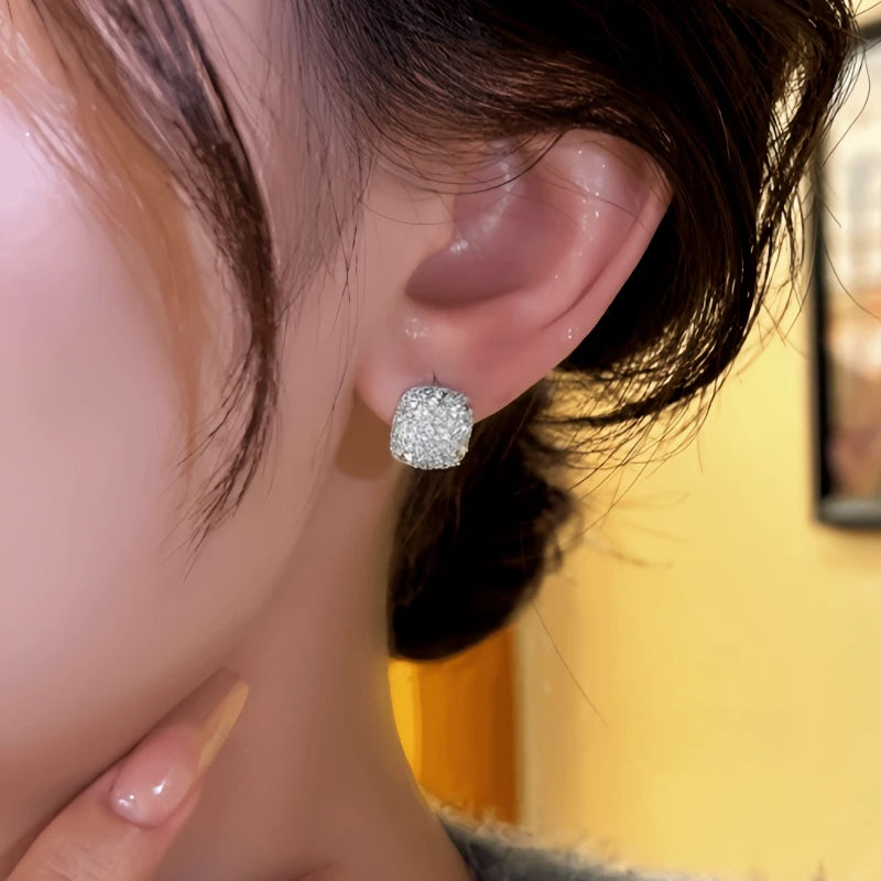 Model showcasing the dangle and style of the 14K Gold-Plated Elegant Zircon Square Hoop Earrings