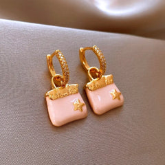 Close-up detail of the sparkling zircons and plating on the Star Bag Earrings