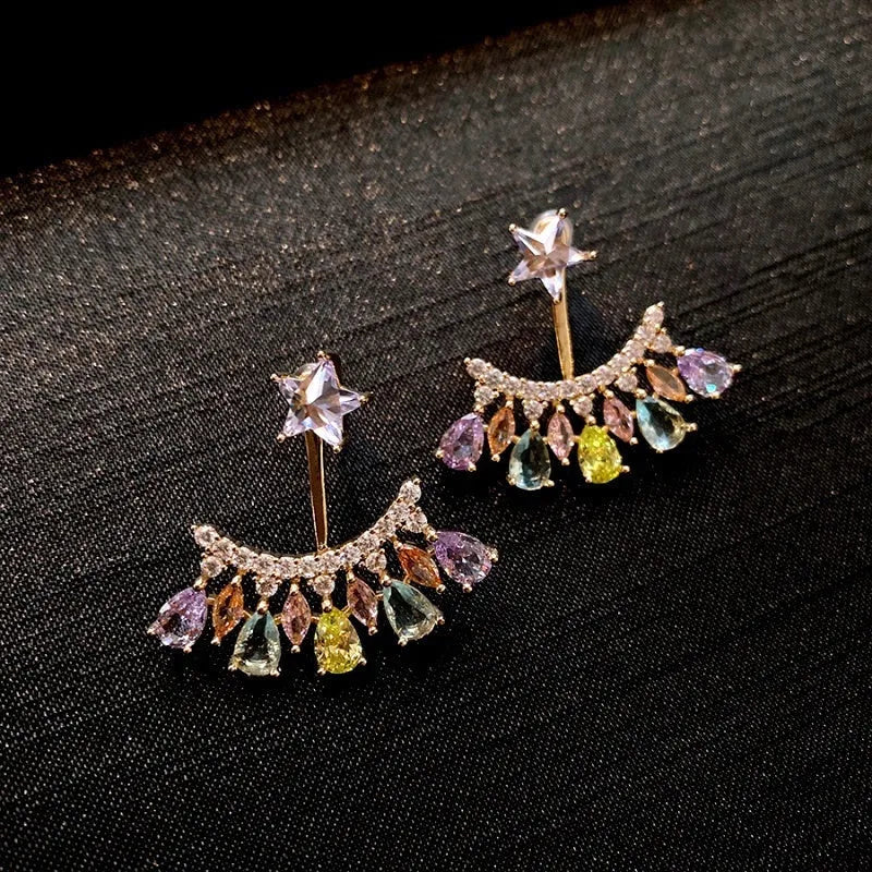 Close-up detail of the sparkling zircons and plating on the Star Jacket Earrings