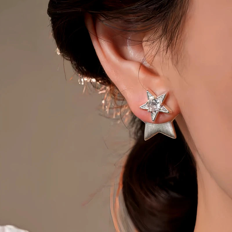 Model showcasing the dangle and style of the 14K Gold-Plated Elegant Zircon Star Earrings