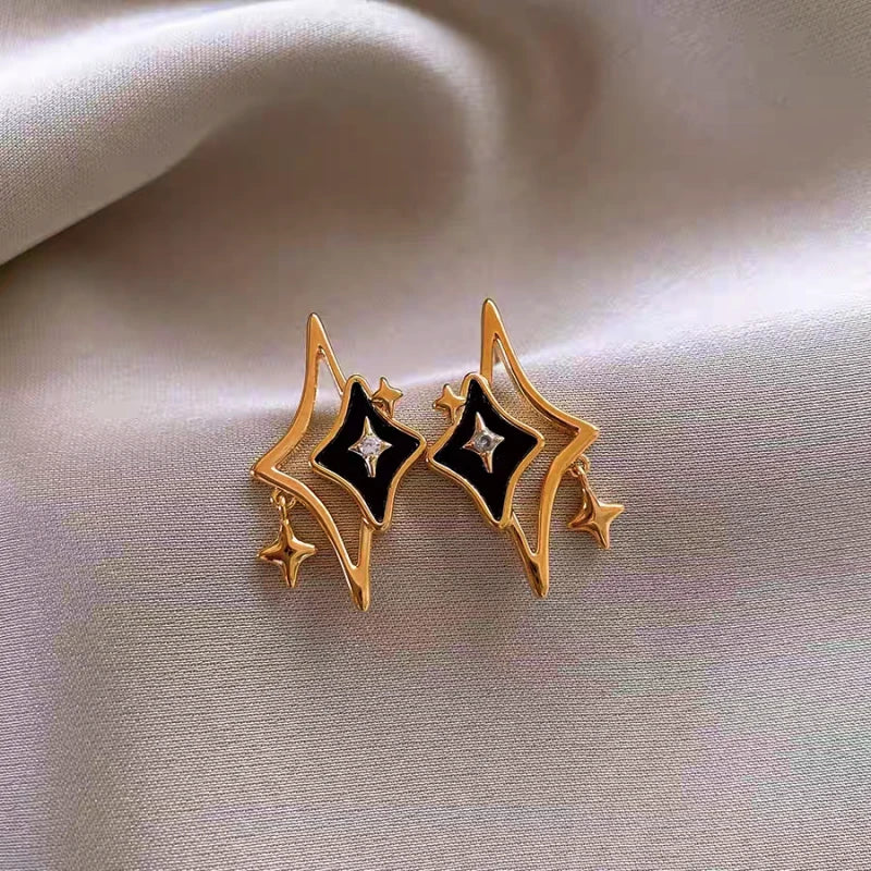 Close-up detail of the sparkling zircons and plating on the Star Dangle Earrings